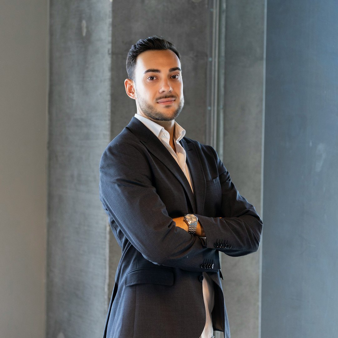 Portrait of a Belgian man of North African descent in his 30s, finance director